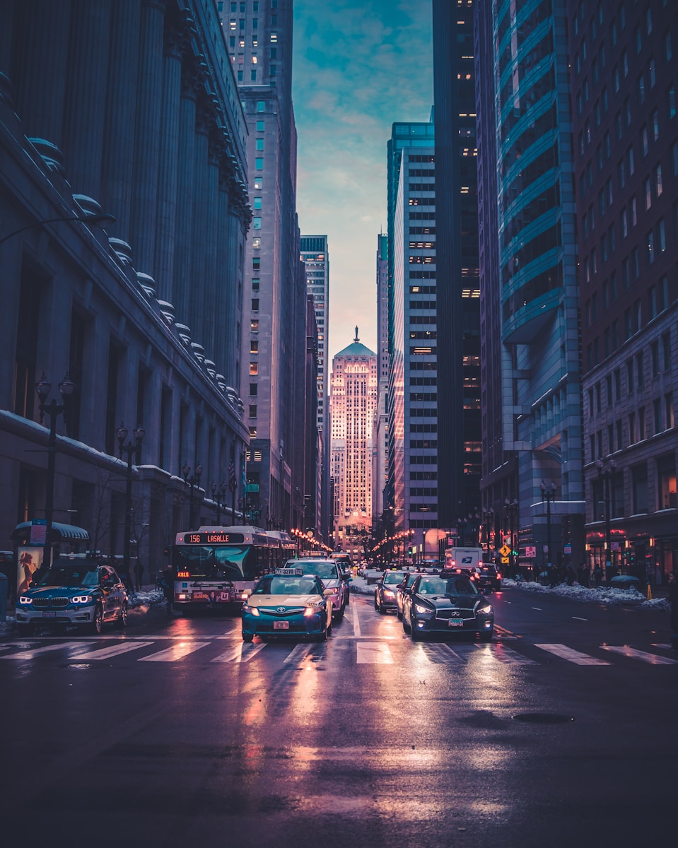 vehicles near buildings at night time
